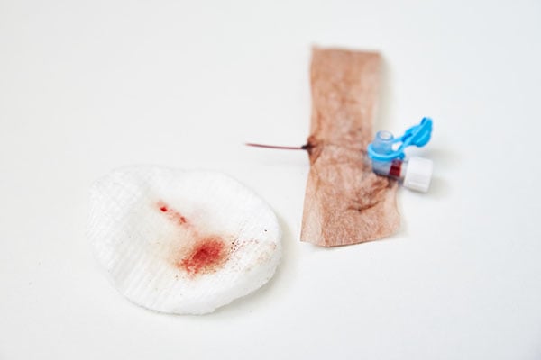 Used IV catheter and bandage